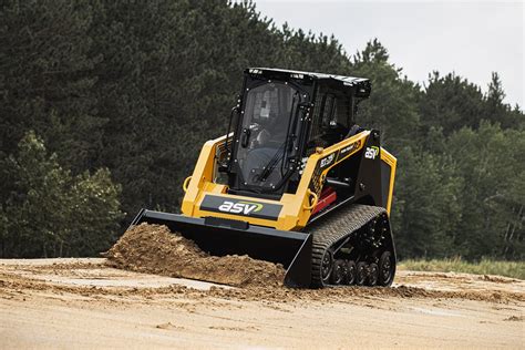 running a skid steer|driving a skid steer loader.